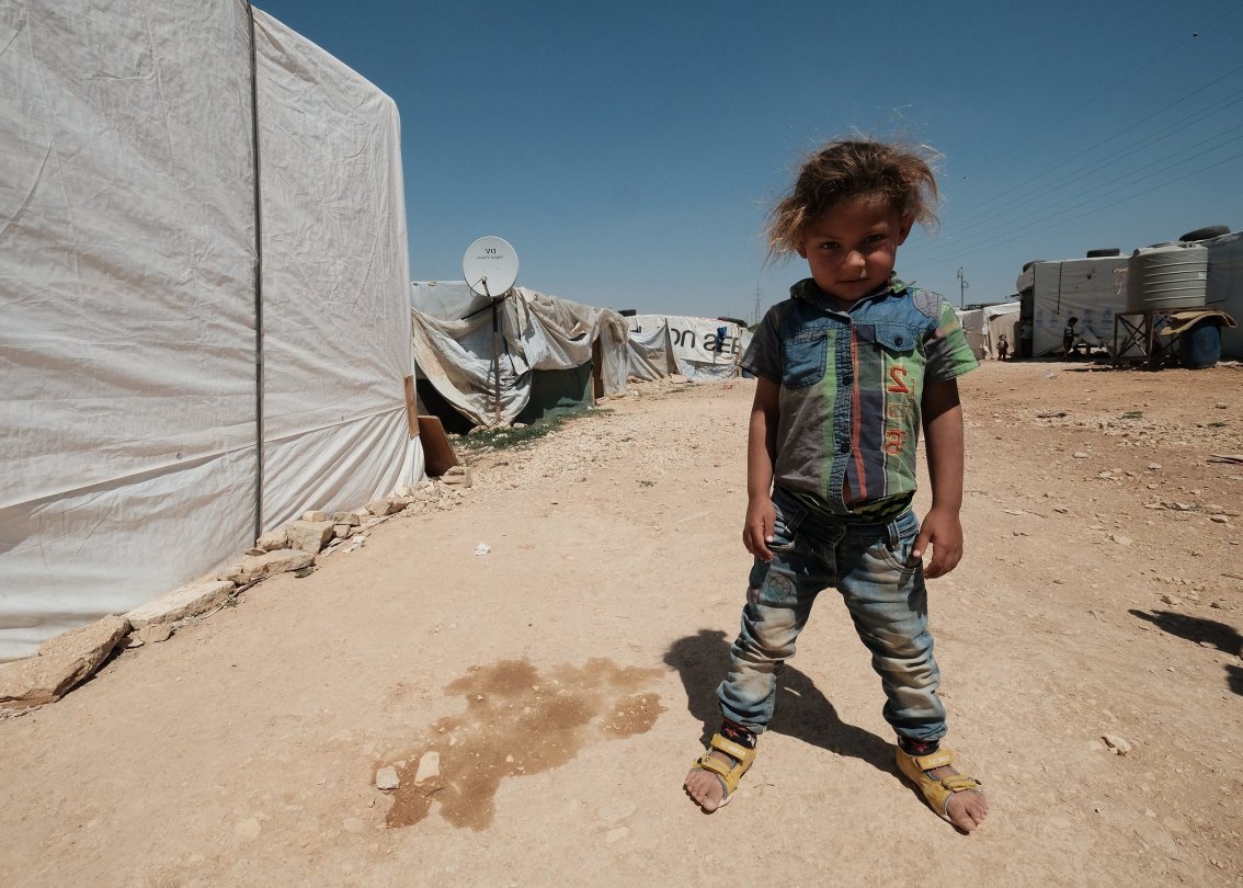 Bambino in un campo profughi in Siria